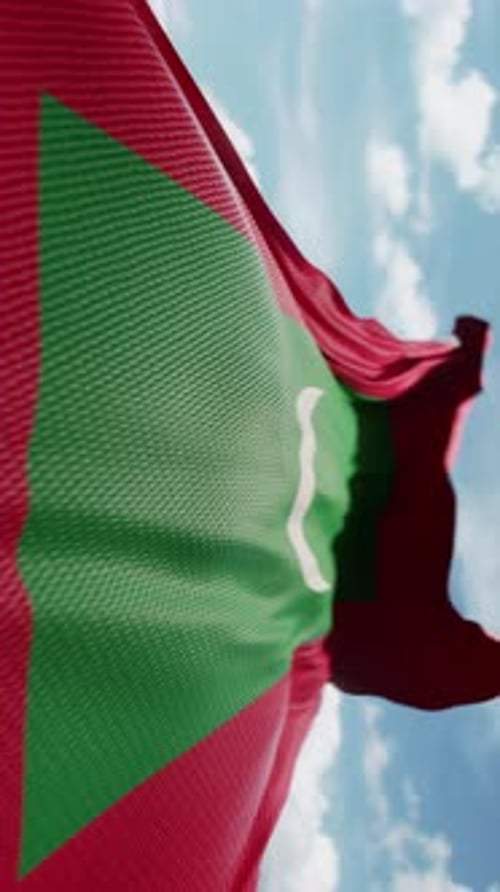 Realistic Maldives Flag Waving Loop Against Blue Sky
