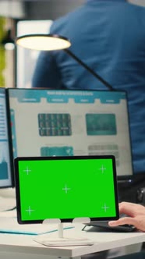 Vertical Video Professional Male Analyst Examining KPI Insights with Mockup on Tablet
