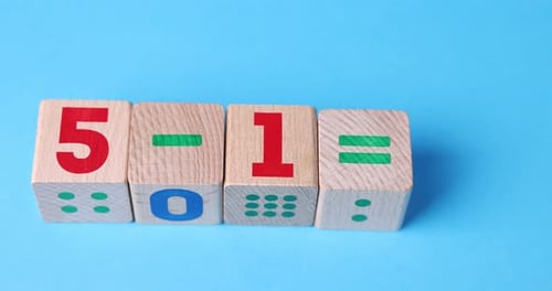 Woman solving mathematical operation made with wooden cubes on light background, closeup