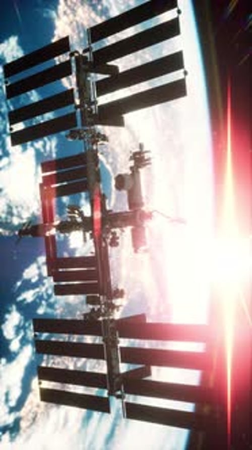 International Space Station Orbiting Earth at Sunset with Solar Panels Extended