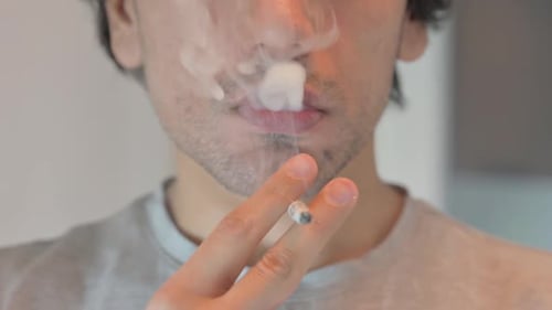 exhaling cigarette smoke Face Close up of Man Exhaling Cigarette Smoke exhaling cigarette smoke Face Close up of Man Exhaling Cigarette Smoke