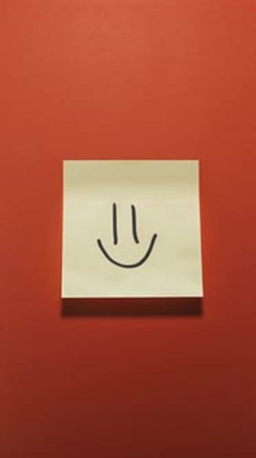 Smiley Face Drawn on a Sticky Note