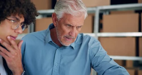 Men Collaborating in a Business Warehouse Workplace