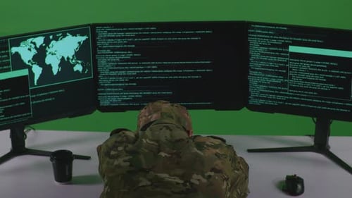Back View Of Tired Asian Man Soldier Sleeping While Write Code With Multiple Screens In Green Screen