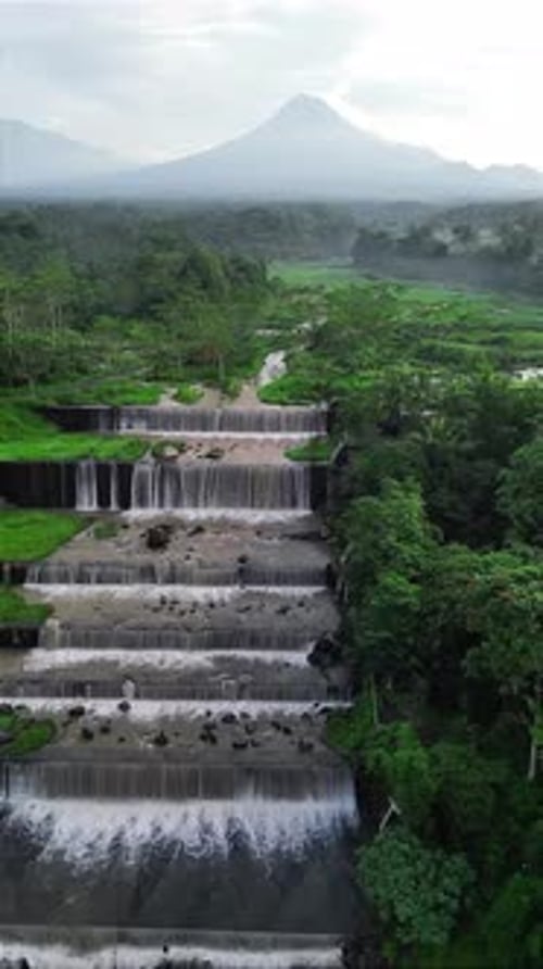 Beautiful Terraced Waterfalls with Mount Merapi in the Background, Indonesia