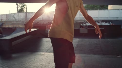 Extreme Skateboarder Riding on Skate Board at City Skate Park. Close Up