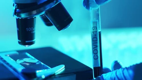 Microscope and a Tube with Virus Closeup of Scientific Laboratory in Hospital Epidemic Disease