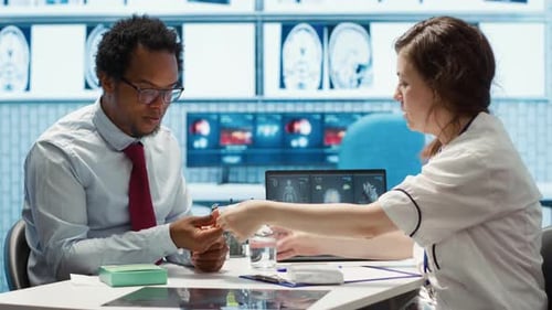 Doctor Explains Medication to Patient in Clinic