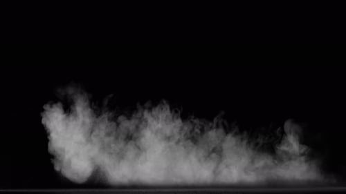 Sahara Collection: Sand dust stream shot across from right side to left side scattering slowly on a