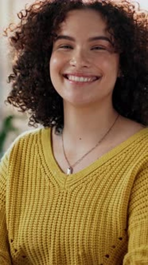 Smiling Young Woman in Yellow Sweater Close-Up