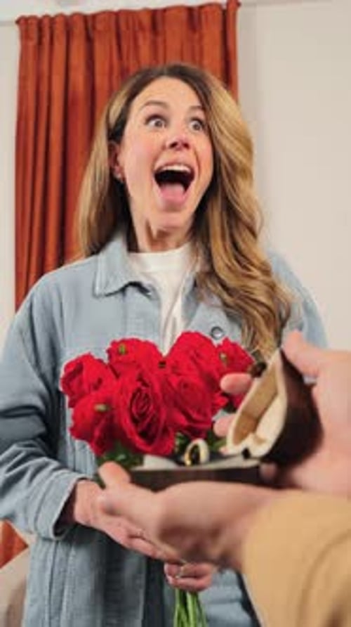 Excited Woman Receiving Engagement Ring with Bouquet