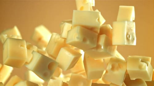 Super Slow Motion Pieces of Cheese Fly Up and Fall Down Filmed on a Highspeed Camera at 1000 Fps