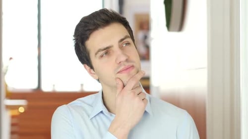 Man Thinking with Hand to Face
