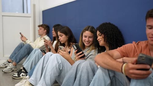 Group of young friends addicted to their smartphones