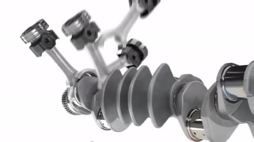 Virabrequim brilhante com engrenagens em fundo branco para uso industrial