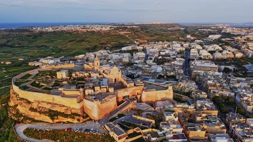 Stunning sunset view of Mdina, Malta's historic architecture