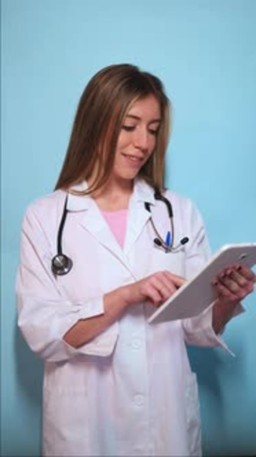 Female Doctor Working with a Tablet