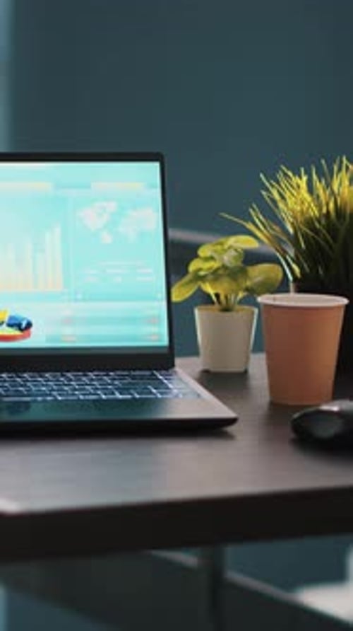 Laptop Displays Data Analytics in Modern Office