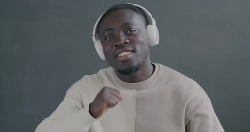 Young Adult Dancing with Headphones On