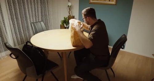 Man Checking Wrong Food Delivery at Home
