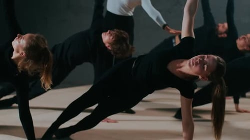 Side View Group of Theater Actors and Actresses in Plank Position Raising Hand Looking Up As Stage