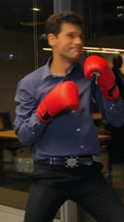 Young Adult Man Shadow Boxing in an Office