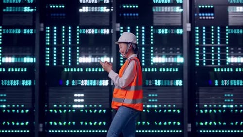 Asian Female Use Smartphone While Walking in Data Center