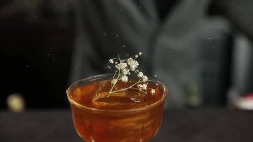 the bartender prepares a cocktail at the bar