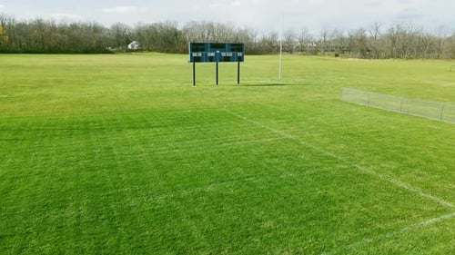 Aerial View of an Empty Football Field on a Sunny Day