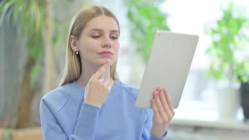 Woman Working on Digital Tablet