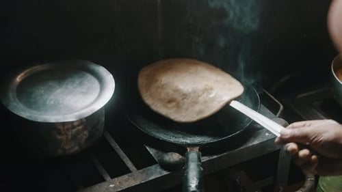 Flatbread Cooking on Pan with Steam