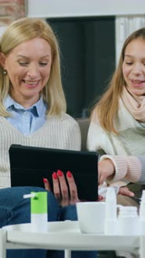 Girl Putting Her Head on Mother's Shoulder While Revisioning Together Funny and Intersting Movie or
