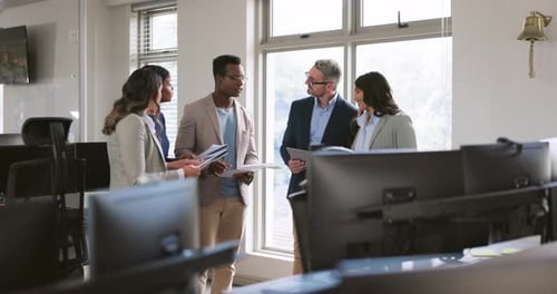 Business Team Meeting to Discuss Documents in Office