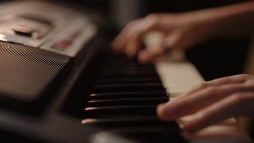 Fingers Play Keys on Digital Piano Close Up