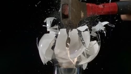Hammer blow shatters a lightbulb in super slow motion with phantom camera
