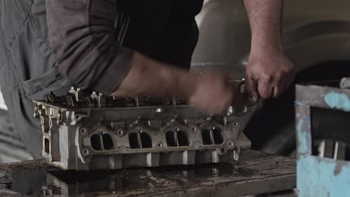 Repairing Car Engine Cylinder Head In The Repair Shop