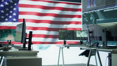 Office with Computer Monitors and American Flag