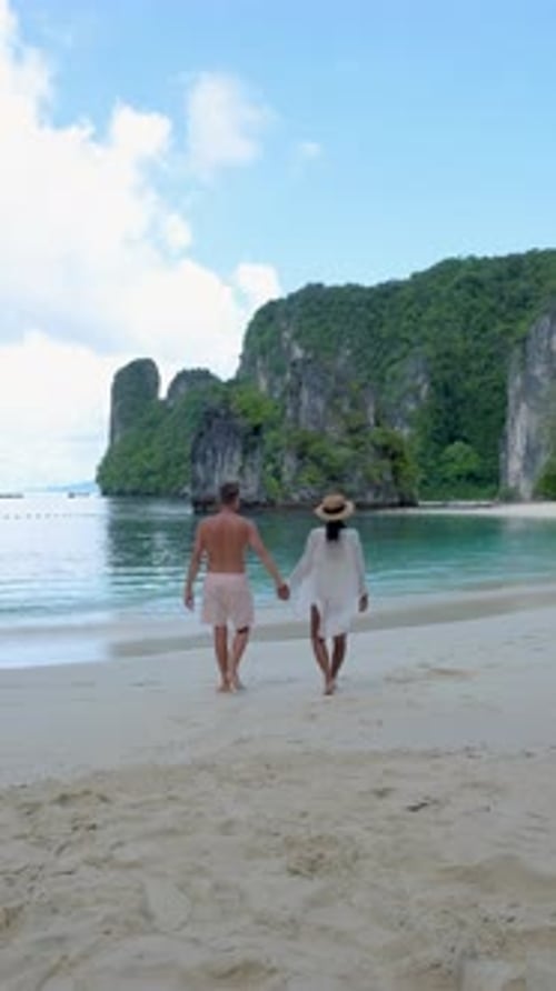 Couple Men and Women on a Tropical White Beach in Thailand Koh Hong Island Krabi