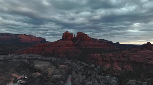 Cathedral Rock In Sedona, Arizona With Overcast At Dusk. wide aerial pullback