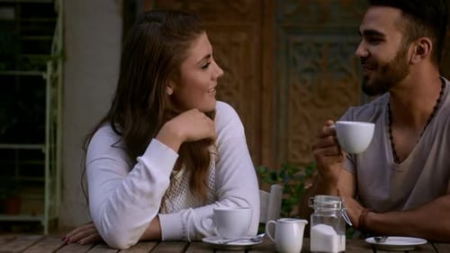 Couple Dating Meeting and Drinking Coffee in Cafe