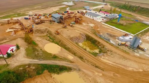 Aerial View of Dump Trucks with Sand Standing on Territory Industrial Factory