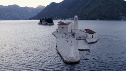 Aerial view of Kotor Bay with church and sea, Montenegro.