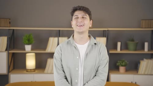 Happy young man smiling.