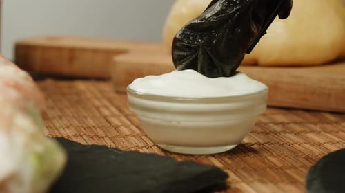 Dipping Dimsun Into White Sauce Closeup Macro Dim Sun Gedza Dumplings Spring Rolls on the Table Food
