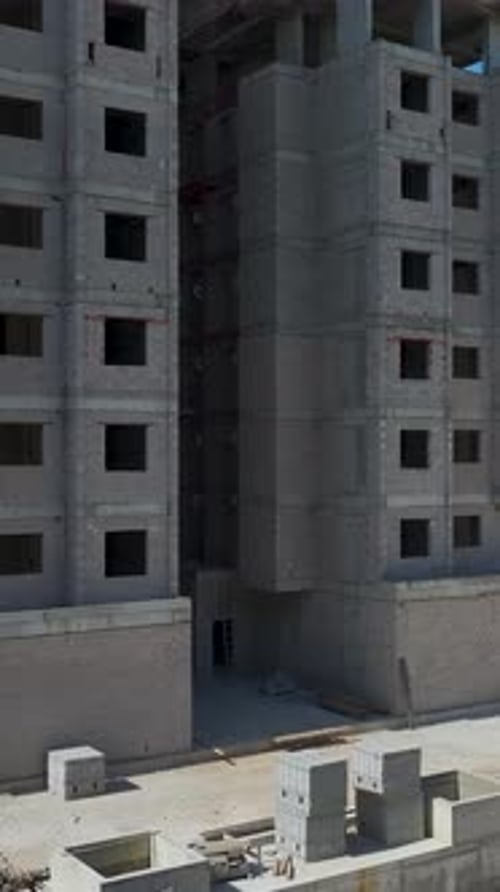 Vertical Video of Construction Team Building Residential House