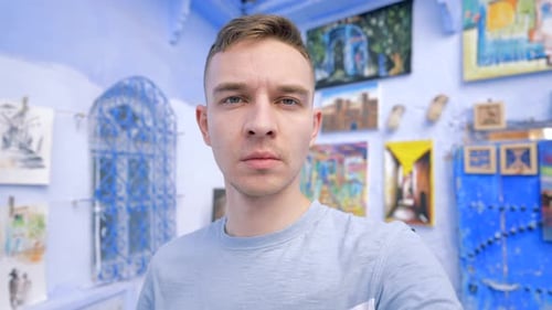 Tourist Looking at Camera in Chefchaouen Morocco