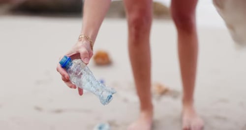 People, hands and beach with bag for recycling plastic bottle, cleaning