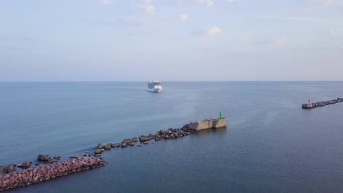 Aerial view of large white cruise liner Seven Seas Splendor arriving at the port of Liepaja (Latvia)