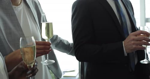Business People Toasting Champagne at an Office Event