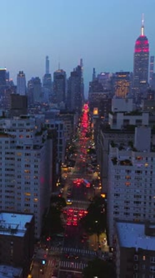 Never sleeping New York with thousands of lights on. Crazy traffic on the busy streets